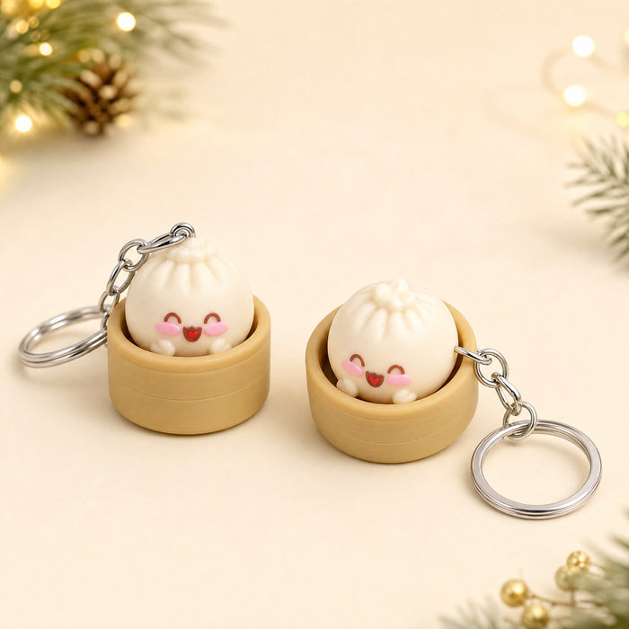 Two Bao Buddy squishy keychains in mini steamers